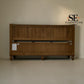 A wooden bed frame with a slatted headboard and a lower storage drawer compartment, shown against a plain beige wall. The SE Furniture Outlet logo is visible in the top right corner.

