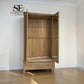 A light oak wood three-drawer wardrobe with mirrored doors, shown open in a room with cream walls and light wood flooring. The 'SE Furniture Outlet' logo is visible in the top left corner.

