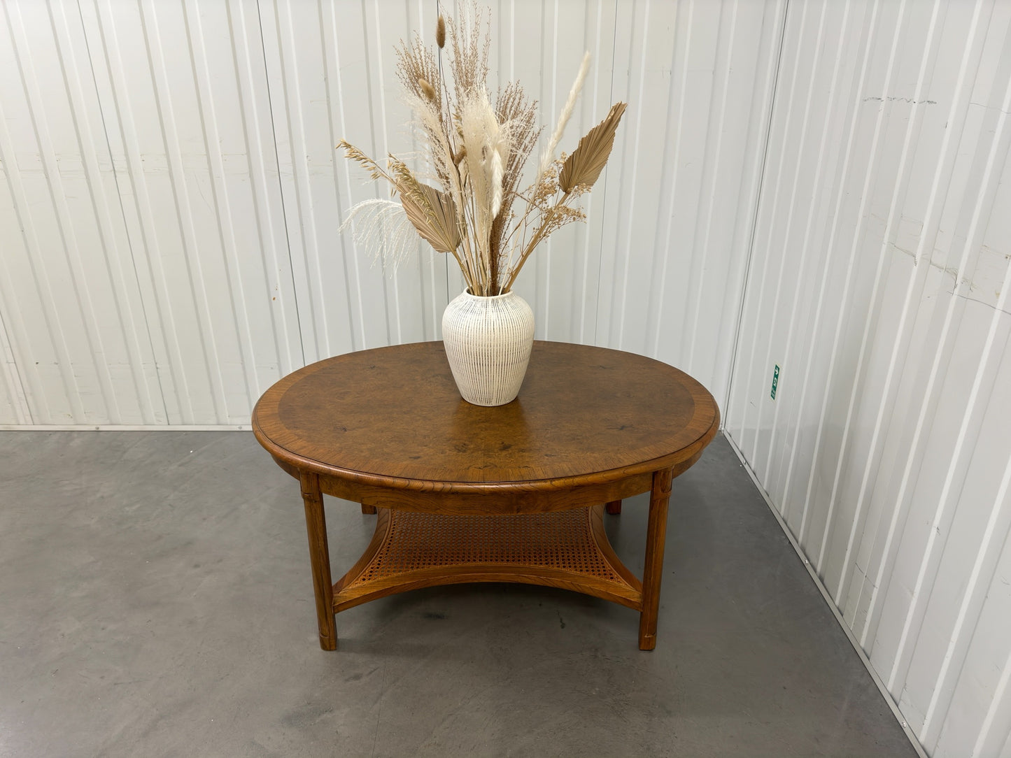 JOHN LEWIS 
HEMINGWAY OVAL COFFEE TABLE MADE WITH MELIA OAK SOLIDS & PIPPY OAK WITH WOVEN CANE SHELF RRP £699