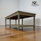 Wooden table on a wooden floor with 'SET Furniture Outlet' branding.

