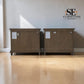 Two matching medium-brown wooden storage cabinets or side tables with white product tags, shown side-by-side on a light wood floor against a textured off-white wall. An 'SE FURNITURE Outlet' logo is visible in the top right corner.

