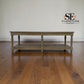 Wooden table on a wooden floor with 'SE Furniture Outlet' logo.

