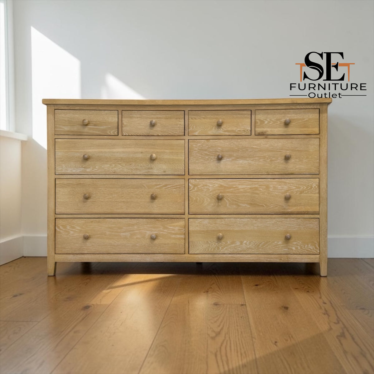 Wooden dresser with multiple drawers on a wooden floor, featuring the SET Furniture Outlet logo.

