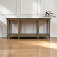 A tall gray wardrobe with open doors, showing light wood interior shelves, a hanging rod, and a drawer at the bottom, photographed in a room with light wood flooring. A 'SE Furniture Outlet' logo appears in the top right.

