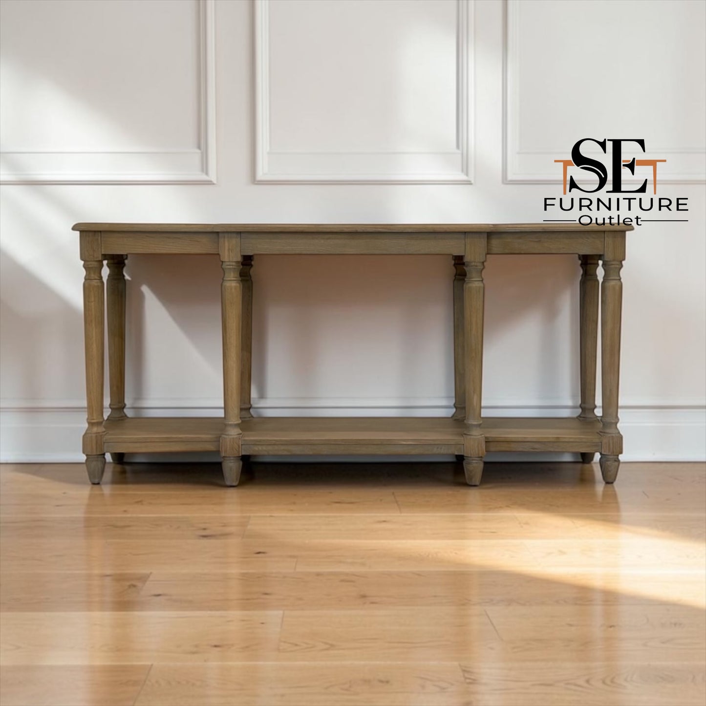 A tall gray wardrobe with open doors, showing light wood interior shelves, a hanging rod, and a drawer at the bottom, photographed in a room with light wood flooring. A 'SE Furniture Outlet' logo appears in the top right.

