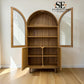 A wooden arched bookcase cabinet with two mirrored doors and four open shelves, shown in a room with light wood flooring and off-white walls. The SE Furniture Outlet logo is visible in the top right corner.

