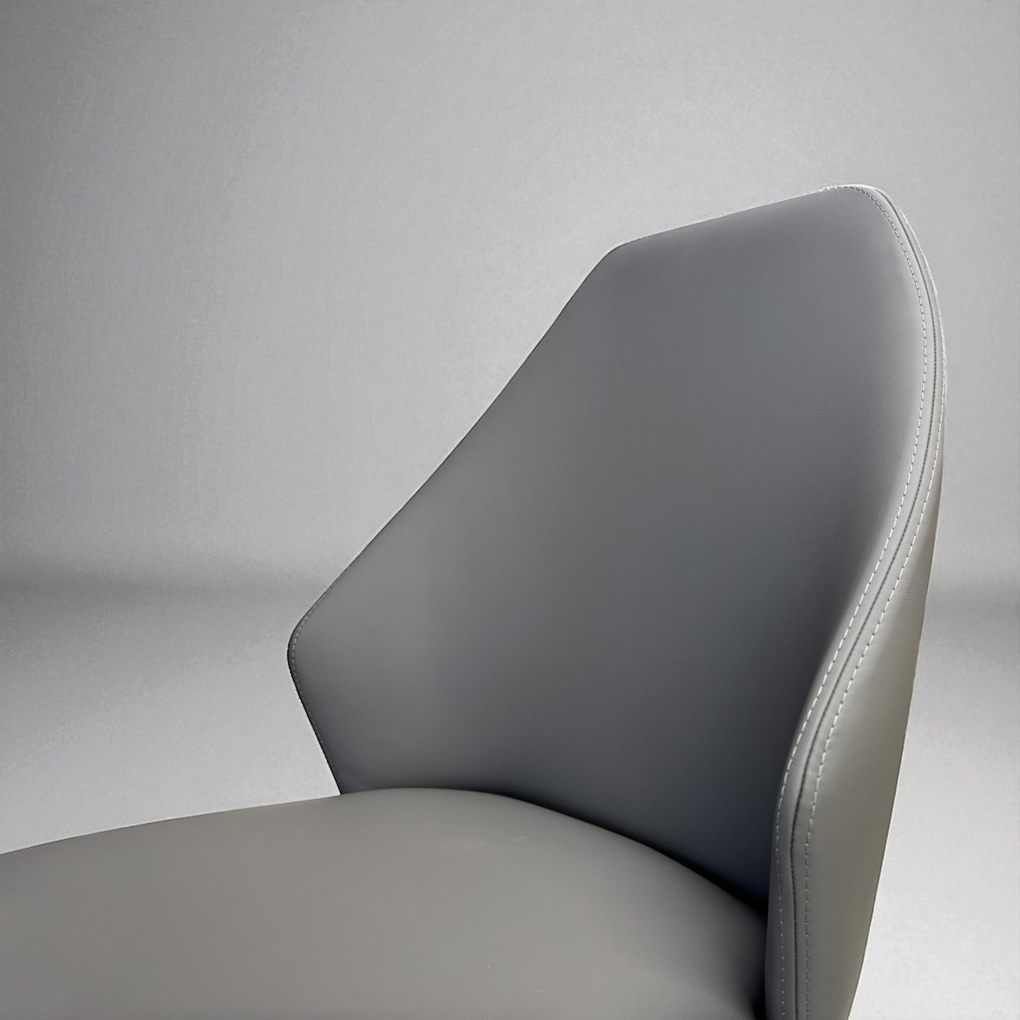 Set of 4 Ergonomic Dining Chairs with Grey Faux Leather and Black Metal Legs, RRP £596.